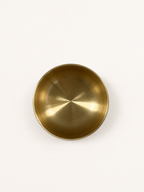 Brass singing bowl from directly overhead, interior filling the frame