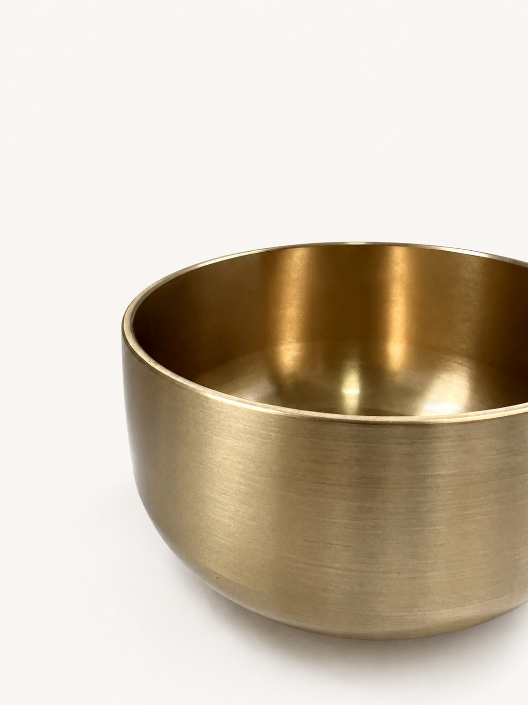 Singing bowl at close range, rim and polished interior in view