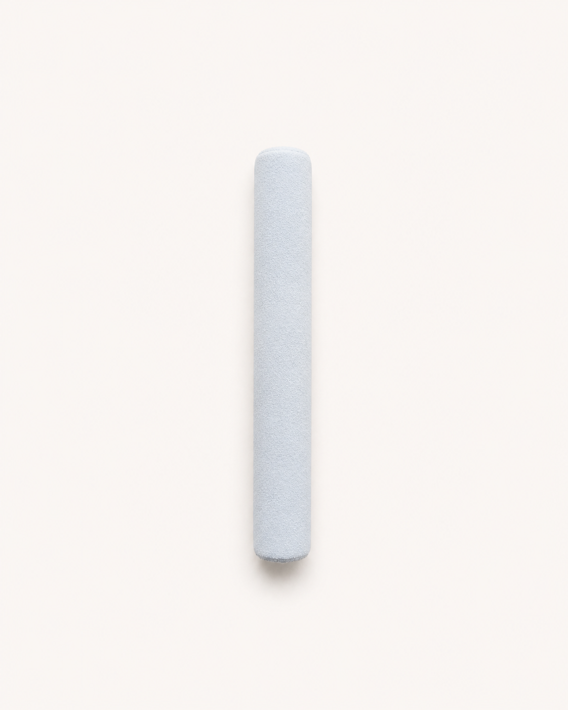 Aritual mallet, a suede-wrapped cylinder in pale blue-grey
