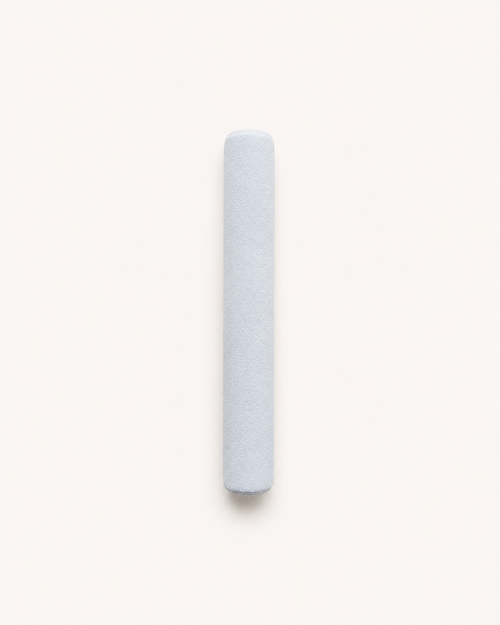 Aritual mallet, a suede-wrapped cylinder in pale blue-grey